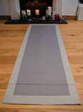 Cotton Hand made grey yoga mat on the wooden floor