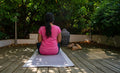 A young women doing yoga on cotton handmade grey yoga mat