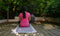 A young women doing yoga on cotton handmade grey yoga mat