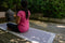 A young women doing yoga on cotton handmade grey yoga mat