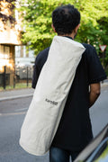 Trendy cotton yoga mat bag carried by man on his shoulder